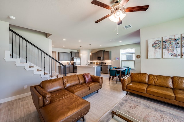 1824 Rachel St, Northlake, TX 76247 - living area featuring a ceiling fan, light wood-type flooring, baseboards, stairs, and recessed lighting