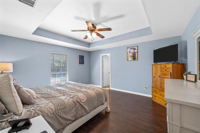 10400 Marigold Rd, Waco, TX 76708 - bedroom with a raised ceiling, baseboards, wood finished floors, and a ceiling fan