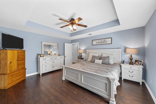 10400 Marigold Rd, Waco, TX 76708 - bedroom with a raised ceiling, dark wood finished floors, baseboards, and ceiling fan