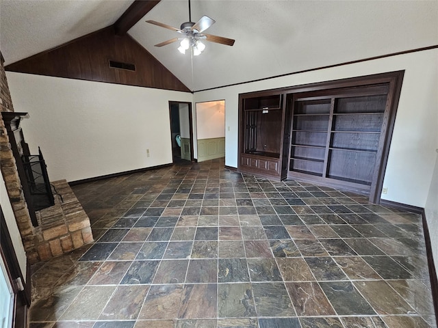 236 La Jolla Dr, Athens, TX 75751 - unfurnished living room featuring ceiling fan, baseboards, and stone finish flooring