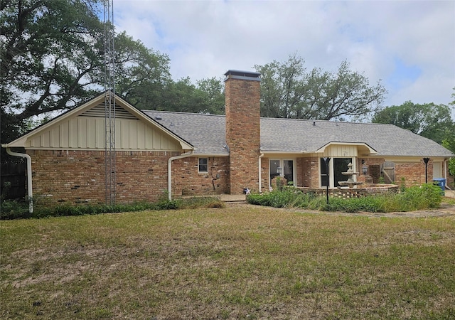 236 La Jolla Dr, Athens, TX 75751 - view of front facade featuring a front lawn, brick siding, a shingled roof, and a chimney