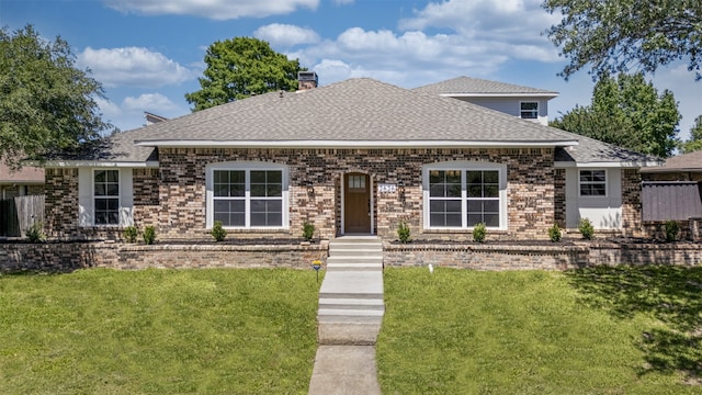 2626 Club Meadow Dr, Garland, TX 75043 - view of front facade with brick siding, a front yard, a shingled roof, and a chimney