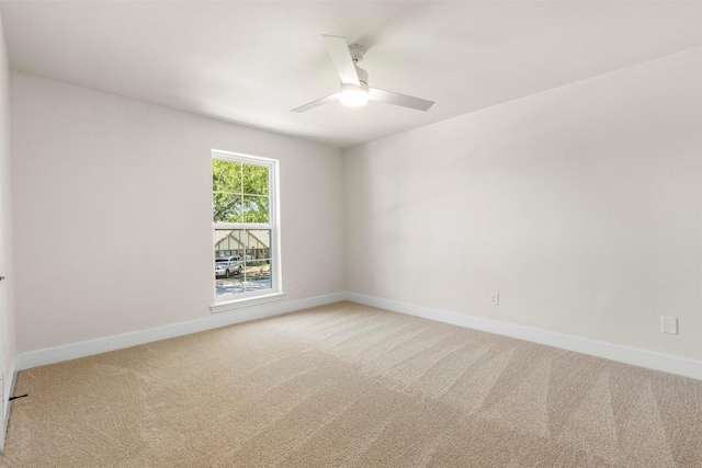 2626 Club Meadow Dr, Garland, TX 75043 - empty room featuring ceiling fan, light colored carpet, and baseboards