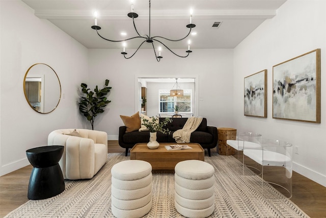 2626 Club Meadow Dr, Garland, TX 75043 - living room with a chandelier, wood finished floors, beamed ceiling, and baseboards