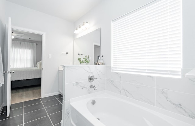 2049 Hartley Dr, Forney, TX 75126 - ensuite bathroom featuring a garden tub, vanity, tile patterned flooring, and a ceiling fan