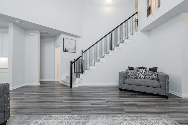 2049 Hartley Dr, Forney, TX 75126 - stairway featuring wood finished floors, a high ceiling, and baseboards