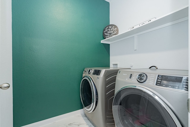 2049 Hartley Dr, Forney, TX 75126 - laundry area featuring washing machine and dryer, marble finish flooring, and baseboards