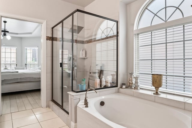 14237 Sugar Hill Dr, Little Elm, TX 75068 - bathroom with ensuite bath, a shower stall, a bath, tile patterned flooring, and a raised ceiling