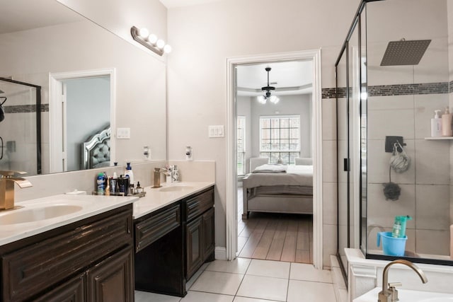 14237 Sugar Hill Dr, Little Elm, TX 75068 - bathroom featuring ensuite bathroom, double vanity, a shower stall, ceiling fan, and tile patterned flooring