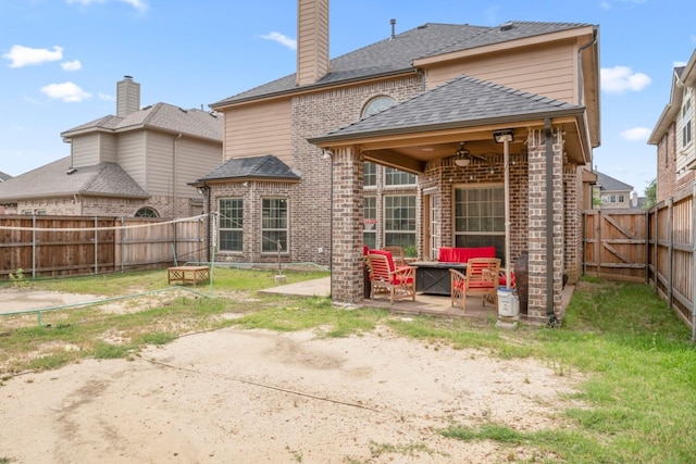 14237 Sugar Hill Dr, Little Elm, TX 75068 - rear view of house with brick siding, ceiling fan, a patio, a fenced backyard, and a chimney
