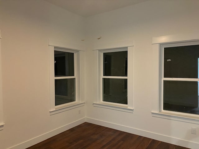 5518 Cold Water Trl, Granbury, TX 76048 - spare room with dark wood finished floors and baseboards