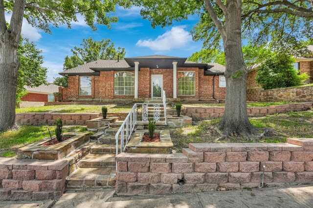4909 Berkeley Ct, Garland, TX 75043 - ranch-style home with brick siding and roof with shingles