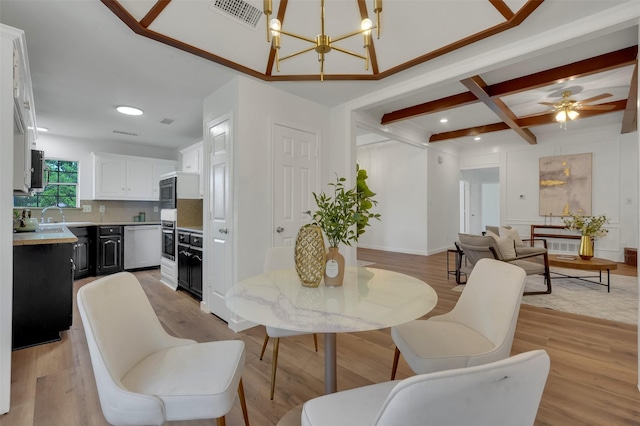 4909 Berkeley Ct, Garland, TX 75043 - dining space with light wood finished floors, a chandelier, beamed ceiling, baseboards, and recessed lighting