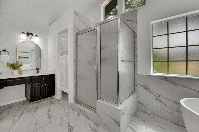 4909 Berkeley Ct, Garland, TX 75043 - full bathroom with a marble finish shower, vanity, marble look tile flooring, and a freestanding tub