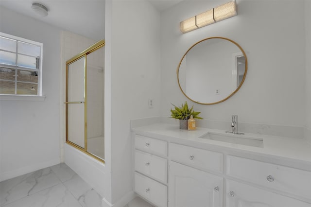 4909 Berkeley Ct, Garland, TX 75043 - full bathroom with vanity, combined bath / shower with glass door, marble finish flooring, and baseboards