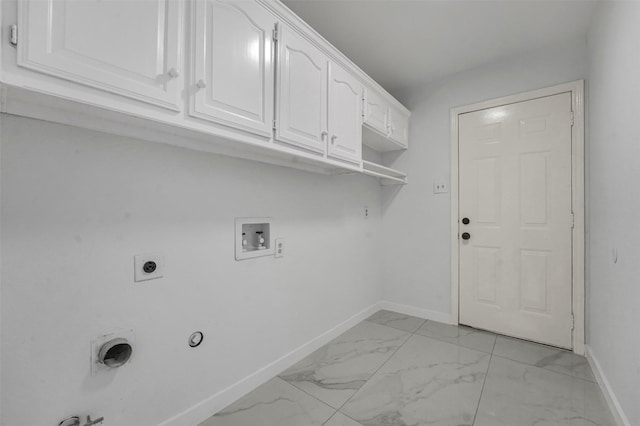 4909 Berkeley Ct, Garland, TX 75043 - laundry room featuring baseboards, cabinet space, hookup for a gas dryer, light marble finish floors, and electric dryer hookup