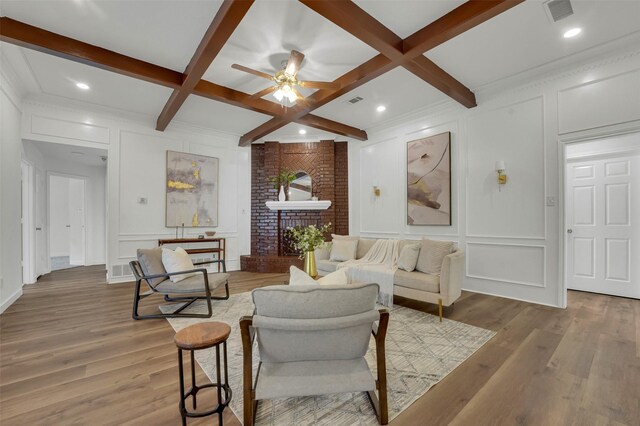 4909 Berkeley Ct, Garland, TX 75043 - living room with a decorative wall, coffered ceiling, beamed ceiling, a ceiling fan, and wood finished floors