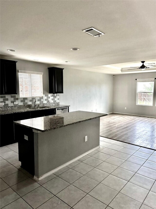 2237 Heaton St, Forney, TX 75126 - kitchen with a kitchen island, a sink, plenty of natural light, light tile patterned floors, and recessed lighting
