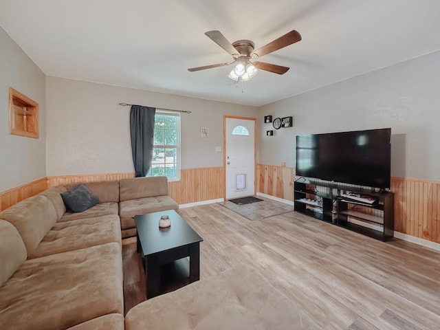 462 Anderson Ln, Fairfield, TX 75840 - living room with a wainscoted wall, wood finished floors, wood walls, and a ceiling fan