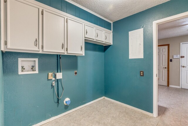 6400 Kingswood Dr, Fort Worth, TX 76133 - washroom with washer hookup, a textured ceiling, cabinet space, hookup for an electric dryer, and light tile patterned flooring