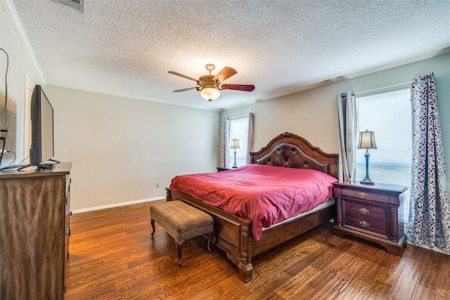 6400 Kingswood Dr, Fort Worth, TX 76133 - bedroom featuring wood finished floors, ornamental molding, a textured ceiling, ceiling fan, and baseboards