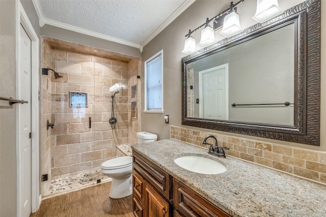 6400 Kingswood Dr, Fort Worth, TX 76133 - full bathroom with vanity, ornamental molding, toilet, a stall shower, and wood finished floors