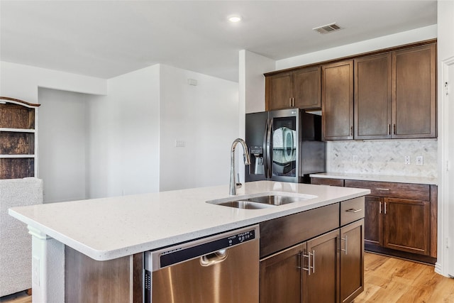 101 Lisa Ln, Royse City, TX 75189 - kitchen featuring dishwasher, refrigerator with ice dispenser, an island with sink, a sink, and light stone countertops