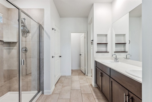 101 Lisa Ln, Royse City, TX 75189 - bathroom with a stall shower, double vanity, baseboards, and built in shelves