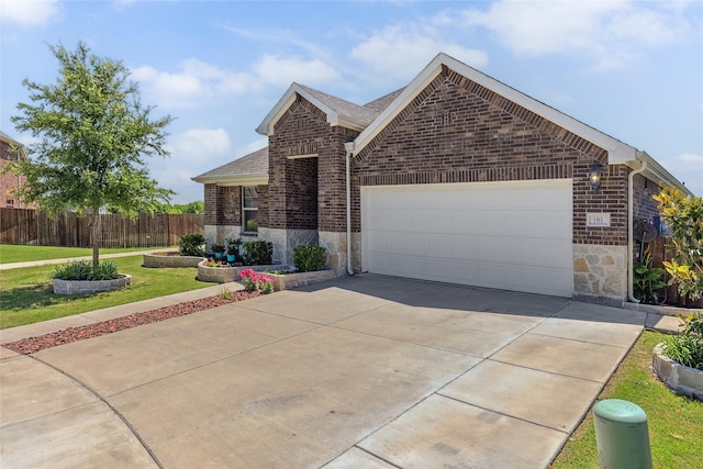 101 Lisa Ln, Royse City, TX 75189 - view of front of property featuring brick siding, an attached garage, concrete driveway, and a shingled roof