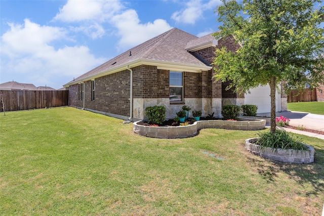 101 Lisa Ln, Royse City, TX 75189 - view of side of property with brick siding, a garage, a shingled roof, and driveway