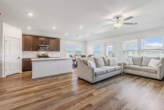 101 Lisa Ln, Royse City, TX 75189 - living area with light wood-style floors, a ceiling fan, and recessed lighting