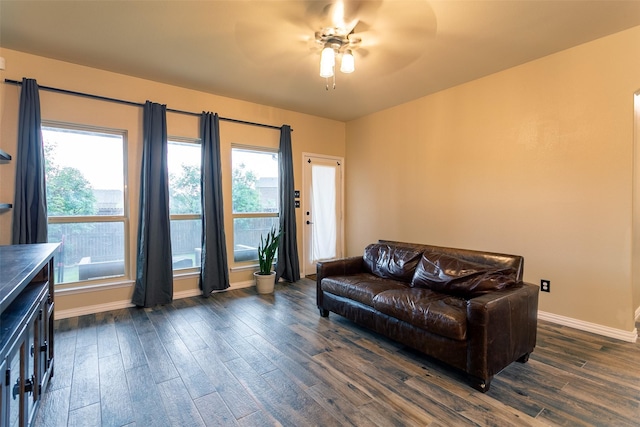 4825 Lazy Oaks St, Fort Worth, TX 76244 - living area featuring dark wood finished floors, healthy amount of natural light, a ceiling fan, and baseboards