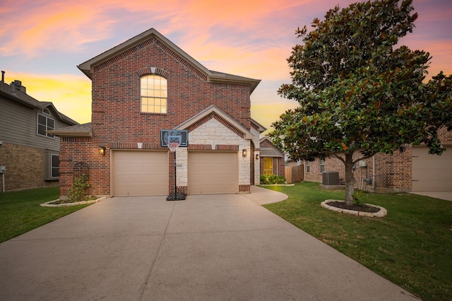 11404 Grapeleaf Dr, Fort Worth, TX 76244 - traditional-style house featuring central AC, driveway, brick siding, and a front yard