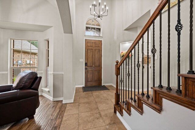 11404 Grapeleaf Dr, Fort Worth, TX 76244 - kitchen featuring dishwasher, a sink, white cabinets, decorative light fixtures, and lofted ceiling