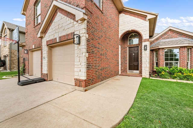 11404 Grapeleaf Dr, Fort Worth, TX 76244 - property entrance featuring a garage, concrete driveway, brick siding, and a lawn