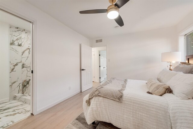1720 Meadow Valley Ln, Dallas, TX 75232 - bedroom featuring light wood-type flooring, ensuite bathroom, a ceiling fan, and baseboards