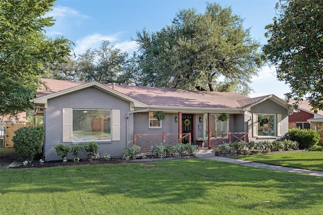 1720 Meadow Valley Ln, Dallas, TX 75232 - ranch-style house featuring covered porch, brick siding, a front yard, and a shingled roof