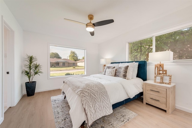 1720 Meadow Valley Ln, Dallas, TX 75232 - bedroom with light wood-type flooring, baseboards, and a ceiling fan