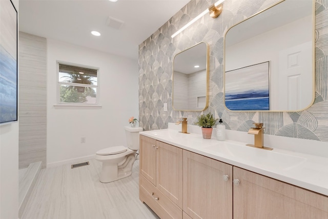 1720 Meadow Valley Ln, Dallas, TX 75232 - bathroom with double vanity, toilet, baseboards, and recessed lighting