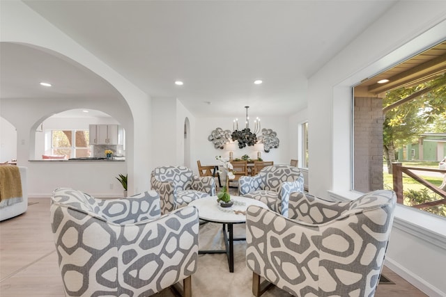 1720 Meadow Valley Ln, Dallas, TX 75232 - living room with healthy amount of natural light, recessed lighting, arched walkways, and a chandelier