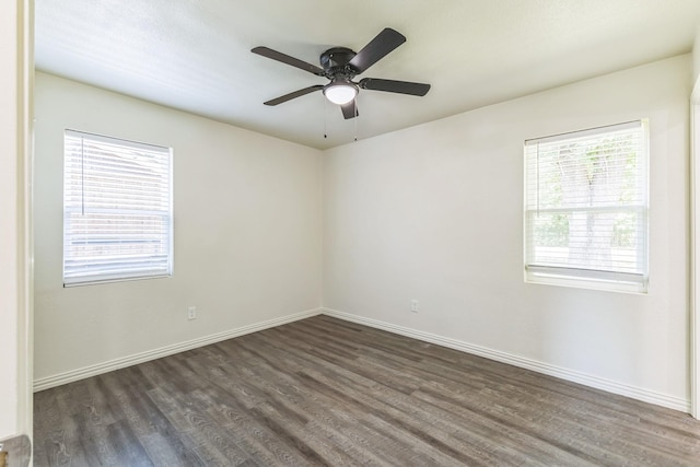 3527 Palm Dr, Mesquite, TX 75150 - unfurnished room featuring dark wood-style flooring, baseboards, and ceiling fan