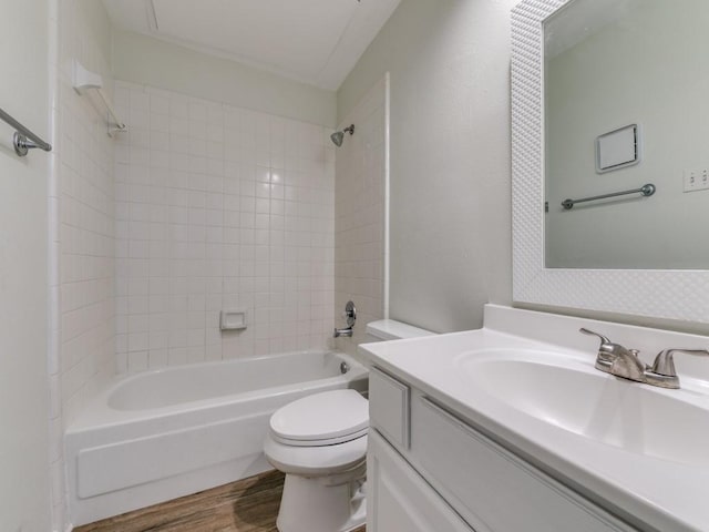 7151 Gaston Ave Unit 906, Dallas, TX 75214 - full bathroom featuring vanity, toilet, shower / bathtub combination, and wood finished floors