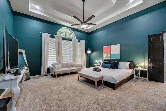 1529 Arrowhead Ln, Carrollton, TX 75007 - carpeted bedroom featuring a high ceiling, a raised ceiling, a ceiling fan, and crown molding