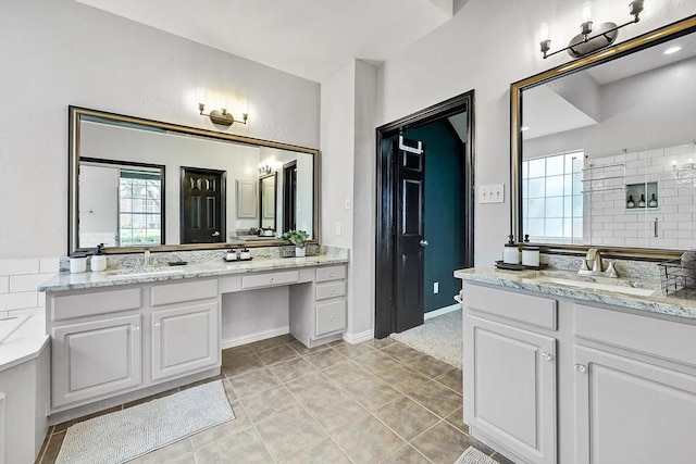 1529 Arrowhead Ln, Carrollton, TX 75007 - bathroom featuring two vanities and tile patterned floors