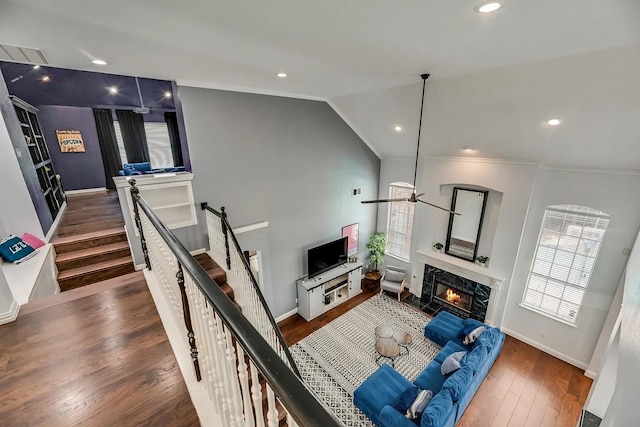 1529 Arrowhead Ln, Carrollton, TX 75007 - living room featuring a high end fireplace, wood finished floors, baseboards, ceiling fan, and crown molding
