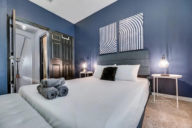 1529 Arrowhead Ln, Carrollton, TX 75007 - carpeted bedroom featuring baseboards and a textured wall