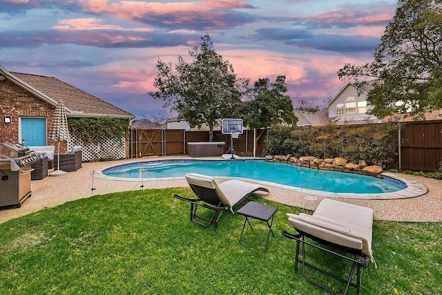 1529 Arrowhead Ln, Carrollton, TX 75007 - pool at dusk featuring a gate and grilling area