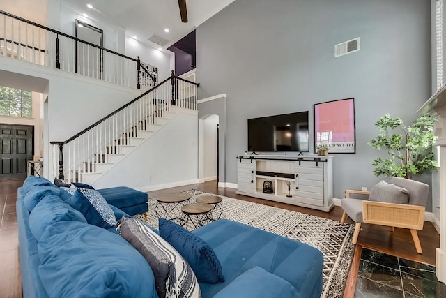 1529 Arrowhead Ln, Carrollton, TX 75007 - living area with a high ceiling, stairway, baseboards, and arched walkways