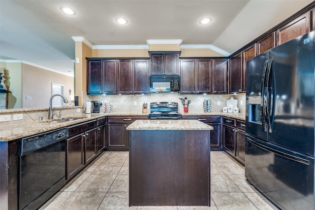 5710 Salisbury Dr, Prosper, TX 75078 - kitchen with black appliances, a sink, light stone countertops, ornamental molding, and dark brown cabinetry