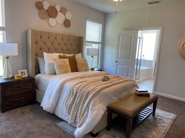 1037 Madelia Ave, Fort Worth, TX 76177 - bedroom featuring light colored carpet, baseboards, and connected bathroom